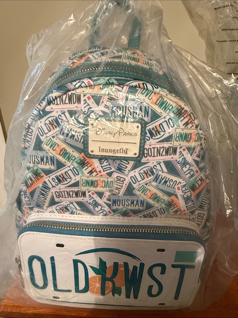 Loungefly Teal, White & Orange Disney Parks Mini Backpack